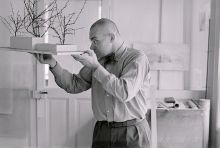 Max Bill in his Zurich studio, studying a model for the pavilion of the Venice Biennale