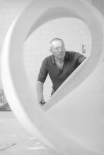 Max Bill working on a plaster sculpture 