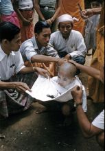 Ritual initiating a young boy into a Buddhist community