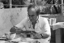 Chillida painting a clay sculpture