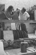 Chillida working on a clay sculpture