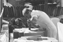 Chillida modeling a clay sculpture