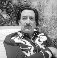 Salvador Dali in the garden of his house in Portlligat