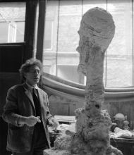 Giacometti working on the sculpture 
