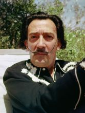 Salvador Dali in the garden of his house in Portlligat