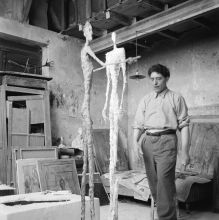 Giacometti with two sculptures
